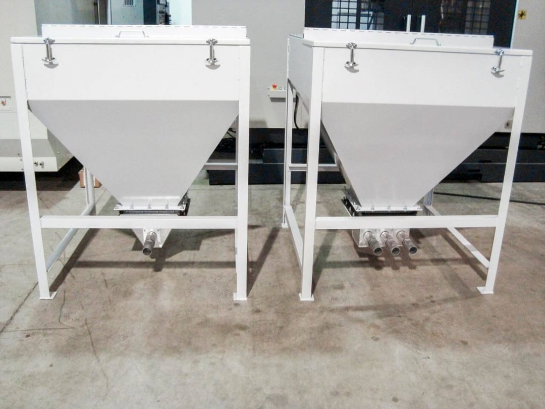 Pair of industrial day bins with conical outlets