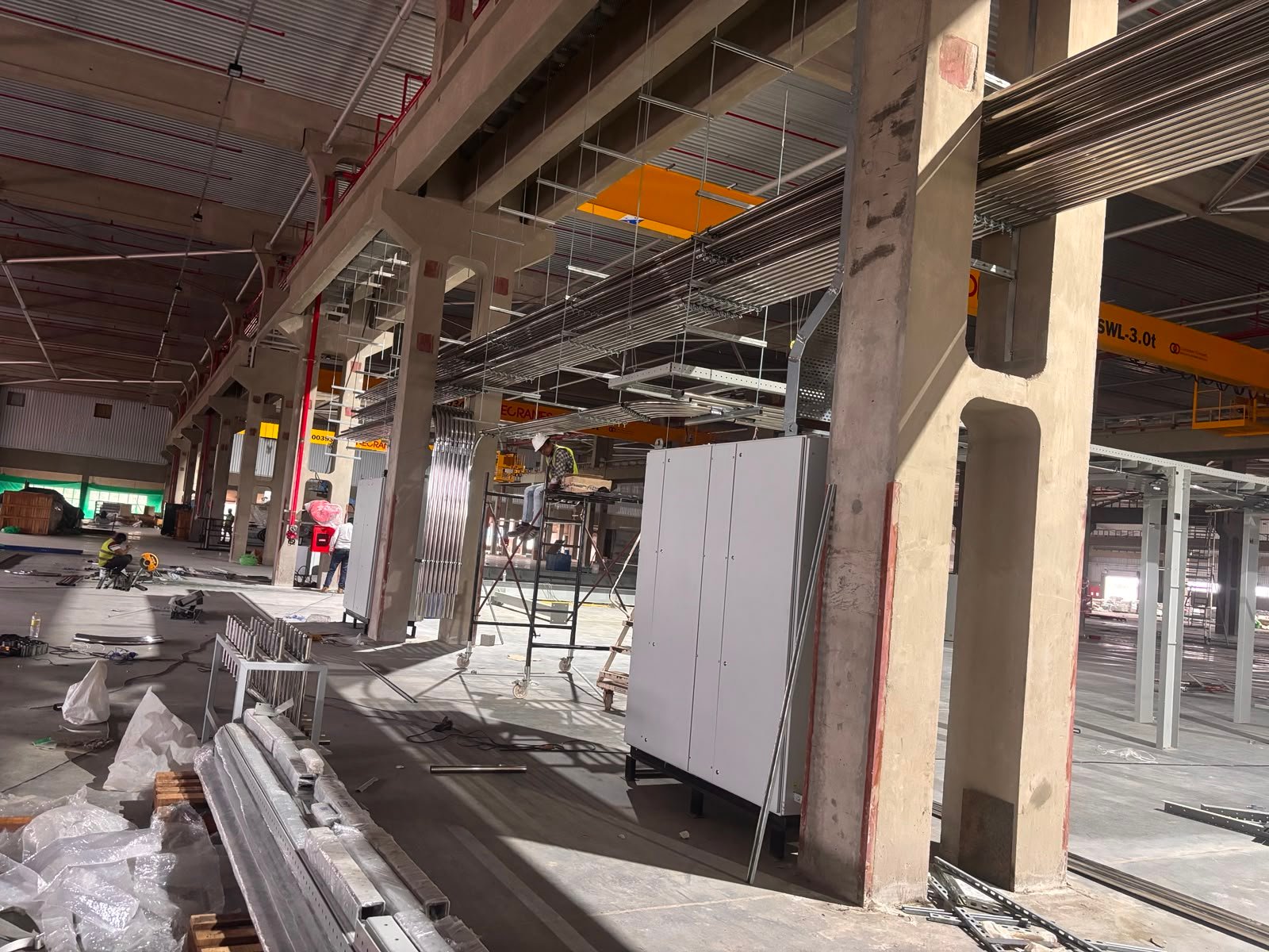 Industrial production facility with structural supports and equipment during installation